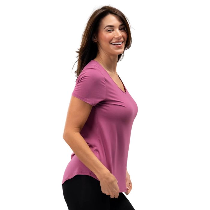 female model wearing wild rose pink brenda u-neck tee side view on white background
