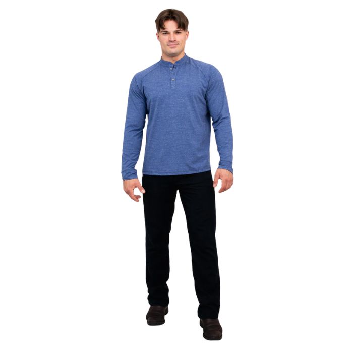 male model wearing denim blue brody long sleeve shenley shirt and black pants front view on white background