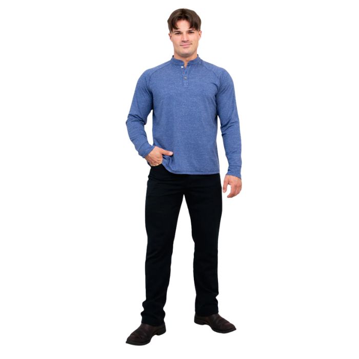 male model wearing denim blue brody long sleeve shenley shirt and black pants front view on white background