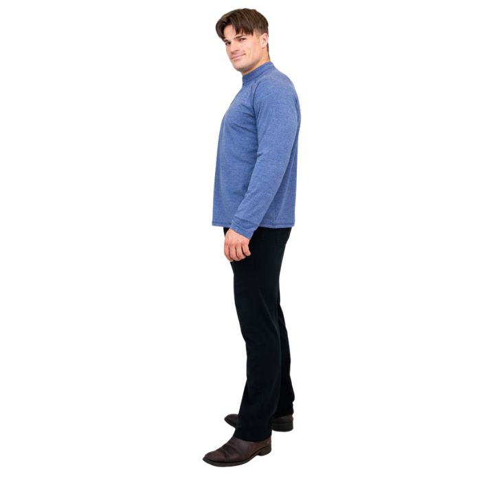 male model wearing denim blue brody long sleeve shenley shirt and black pants side view on white background