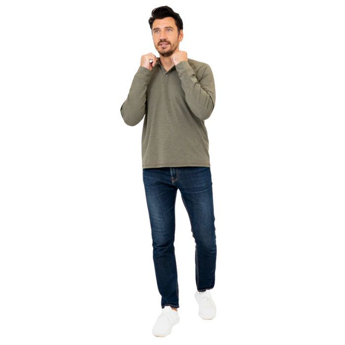 male model wearing khaki green brody long sleeve shenley shirt and blue jeans front view on white background