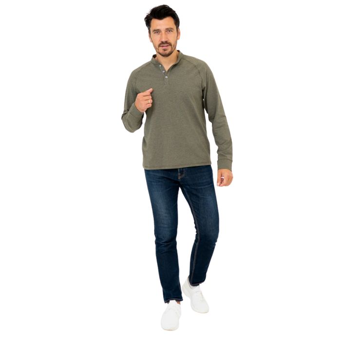 male model wearing khaki green brody long sleeve shenley shirt and blue jeans front view on white background