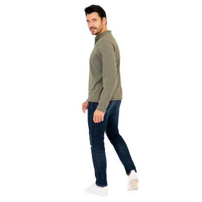 male model wearing khaki green brody long sleeve shenley shirt and blue jeans side view on white background
