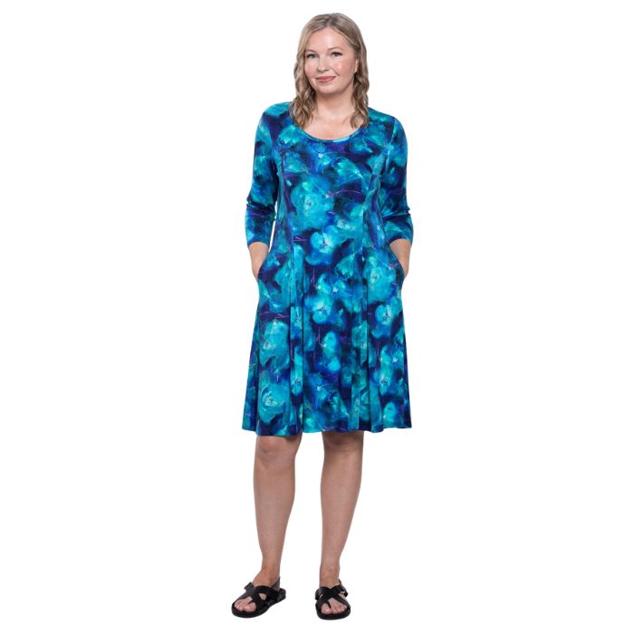 female model wearing ocaen reef print callie dress front view on white background