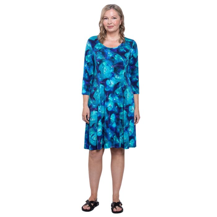 female model wearing ocaen reef print callie dress front view on white background