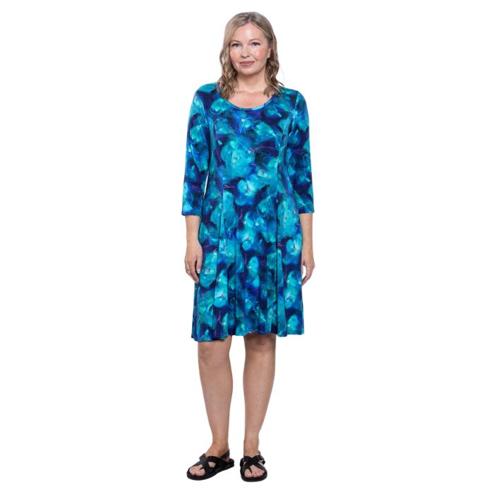 female model wearing ocaen reef print callie dress front view on white background