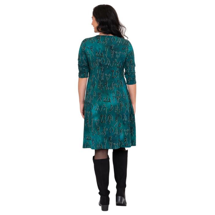 female model wearing teal rune print callie dress back view on white background