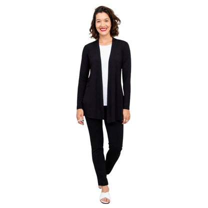 female model wearing black chopra jacket, white reanna tank top and black nadia pants front view on white background