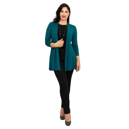 female model wearing teal green chopra jacket, black reanna tank top and black nadia pants front view on white background