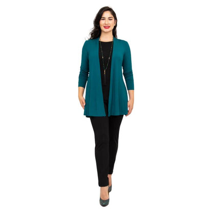 female model wearing teal green chopra jacket, black reanna tank top and black nadia pants front view on white background
