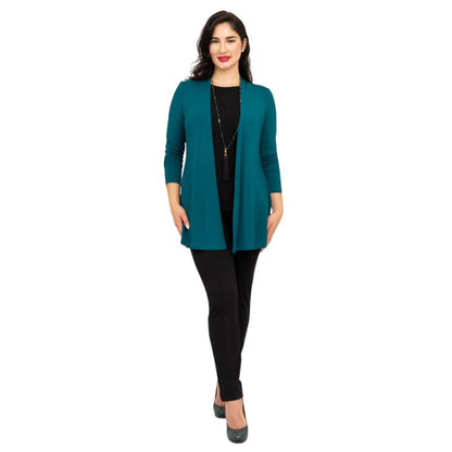 female model wearing teal green chopra jacket, black reanna tank top and black nadia pants front view on white background
