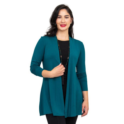 female model wearing teal green chopra jacket front view on white background