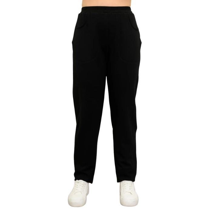 a woman wearing black christine pants waist down front view on white background