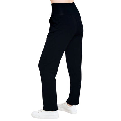 bottom of female model wearing black clair pants back view on white background