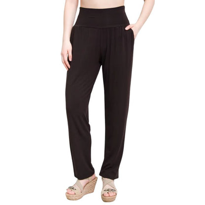 female model wearing coffee brown clair pants waist down front view on white background