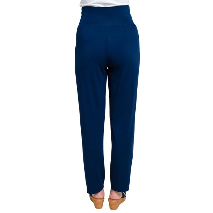 bottom of female model wearing indigo blue clair pants back view on white background