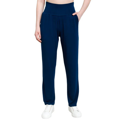 bottom of female model wearing indigo blue clair pants front view on white background