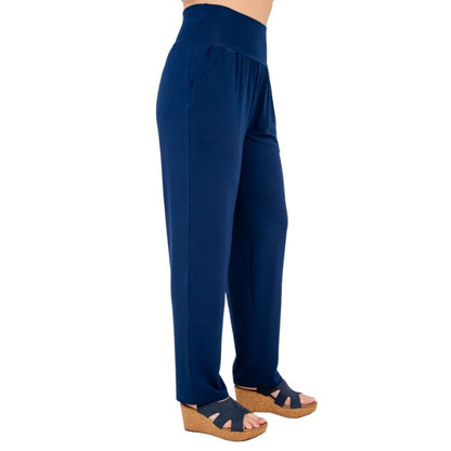 bottom of female model wearing indigo blue clair petite pants side view on white background