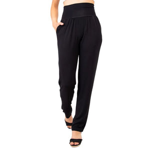 bottm of female model wearing black clair pants tall front view on white backround