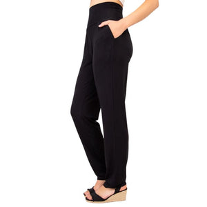 bottm of female model wearing black clair pants tall side view on white backround