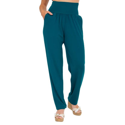 female model wearing teal green clair pants waist down front view on white background