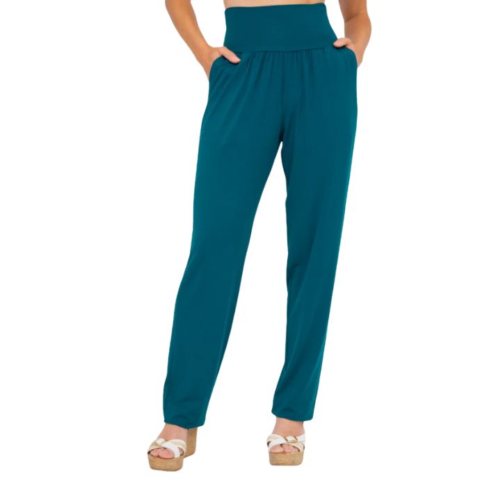 female model wearing teal green clair pants waist down front view on white background