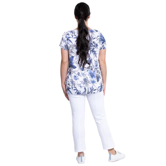 female model wearing peri palm print clara top and white nadine cropped pants back view on white background