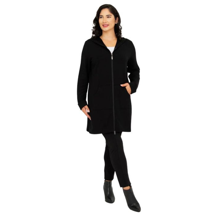 a woman wearing black cortes jacket and black dixie fleece leggings front view set on a studio white background