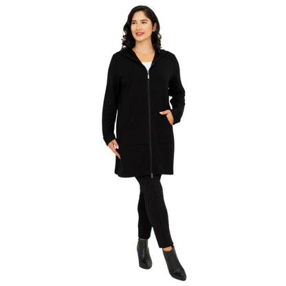 a woman wearing black cortes jacket and black dixie fleece leggings front view set on a studio white background