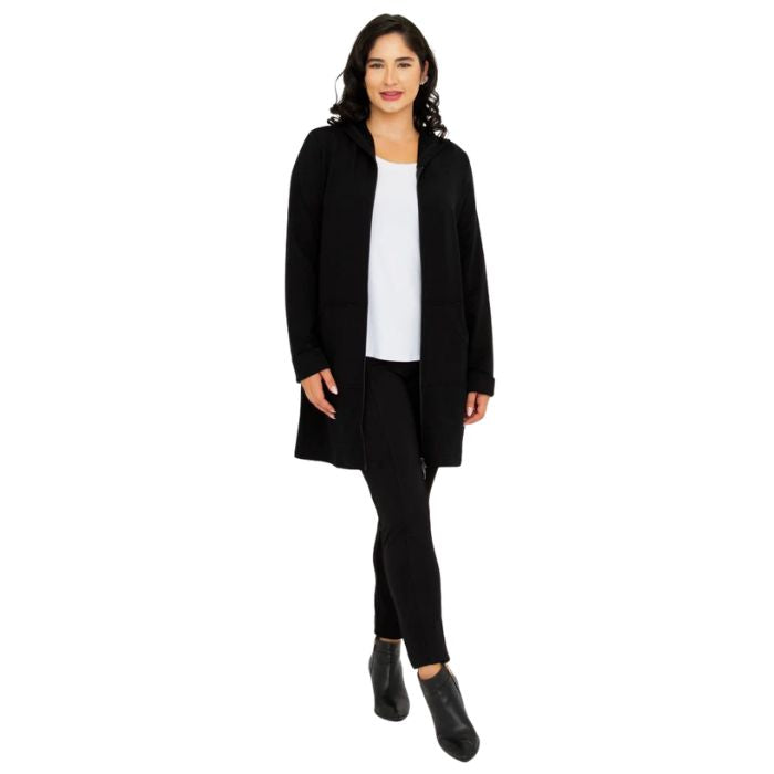 a woman wearing black cortes jacket and black dixie fleece leggings front view set on a studio white background
