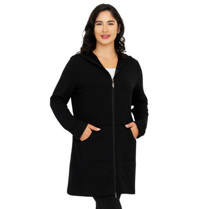 a woman wearing black cortes jacket waist up front view set on a studio white background