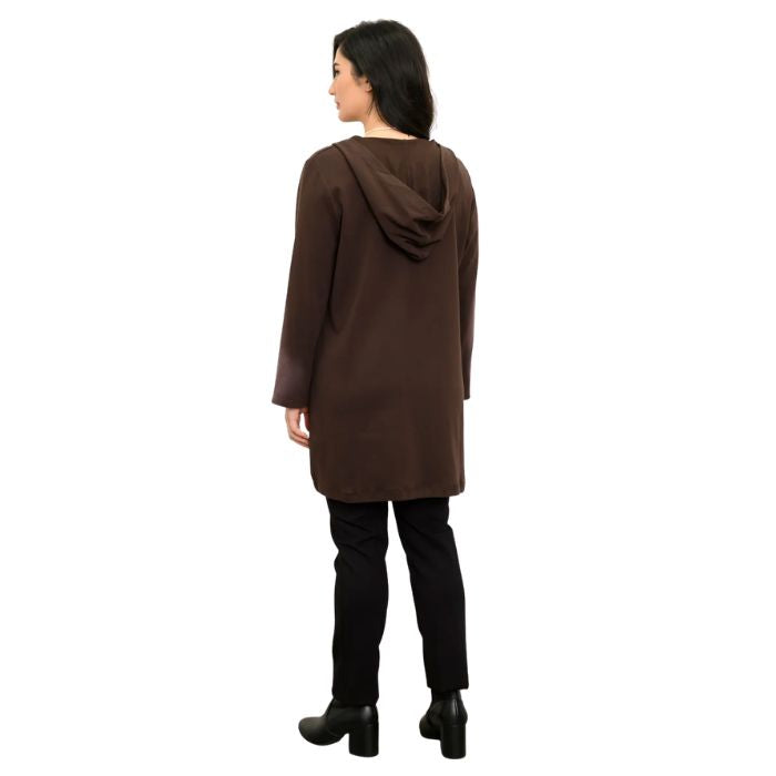 a woman wearing coffee brown cortes jacket and black nadia pants back view set on a studio white background
