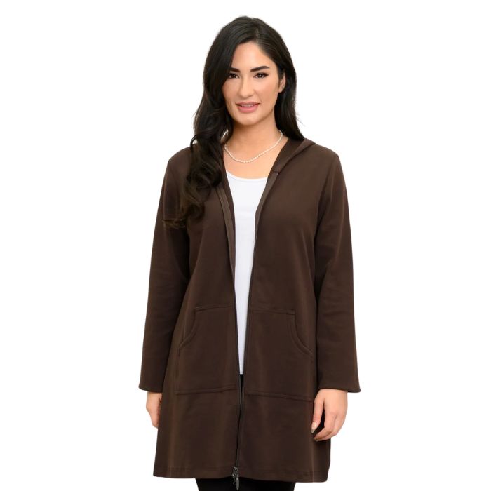 a woman wearing coffee brown cortes jacket and white jazz tank top waist up front view set on a studio white background