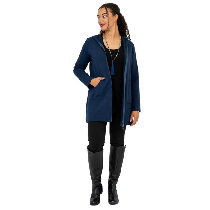 a woman wearing indigo blue cortes jacket and black dixie fleece leggings  front view set on a studio white background