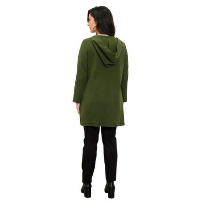 a woman wearing kombu green cortes jacket and black nadia pants back view set on a studio white background