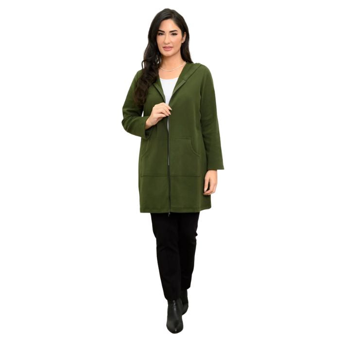 a woman wearing kombu green cortes jacket, white jazz tank top and black nadia pants front view set on a studio white background