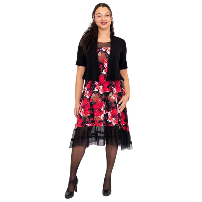 woman wearing lipstick poinsetta print danube dress and black doda jacket front view set on a white background