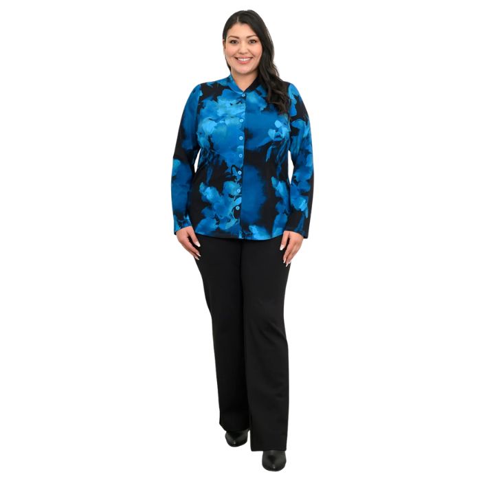 a woman wearing blue space print debbie blouse and black daya pants front view set on a studio white background
