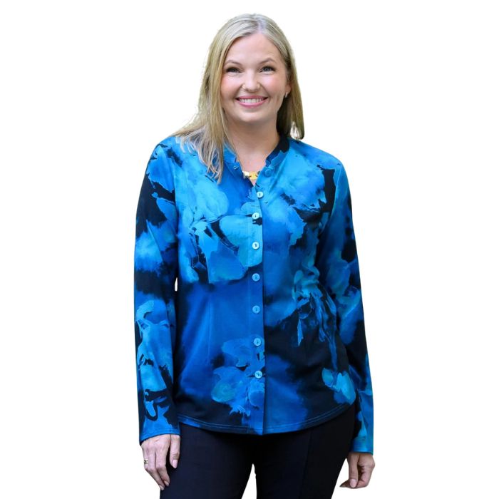a woman wearing blue space print debbie blouse waist up front view set on a studio white background