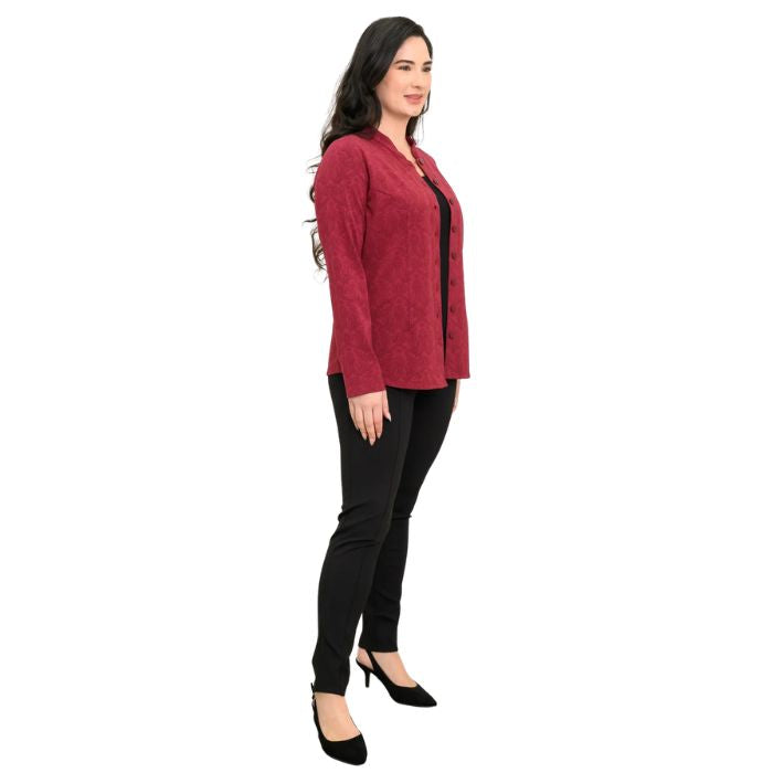 a woman wearing crimson empire print debbie blouse and black nadia pants side view set on a studio white background