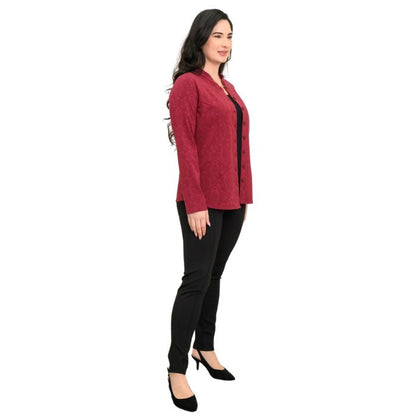 a woman wearing crimson empire print debbie blouse and black nadia pants side view set on a studio white background