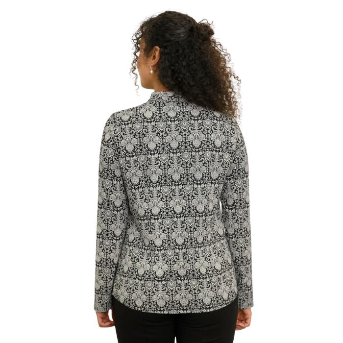 a woman wearing night lace print debbie blouse waist up back view set on a studio white background