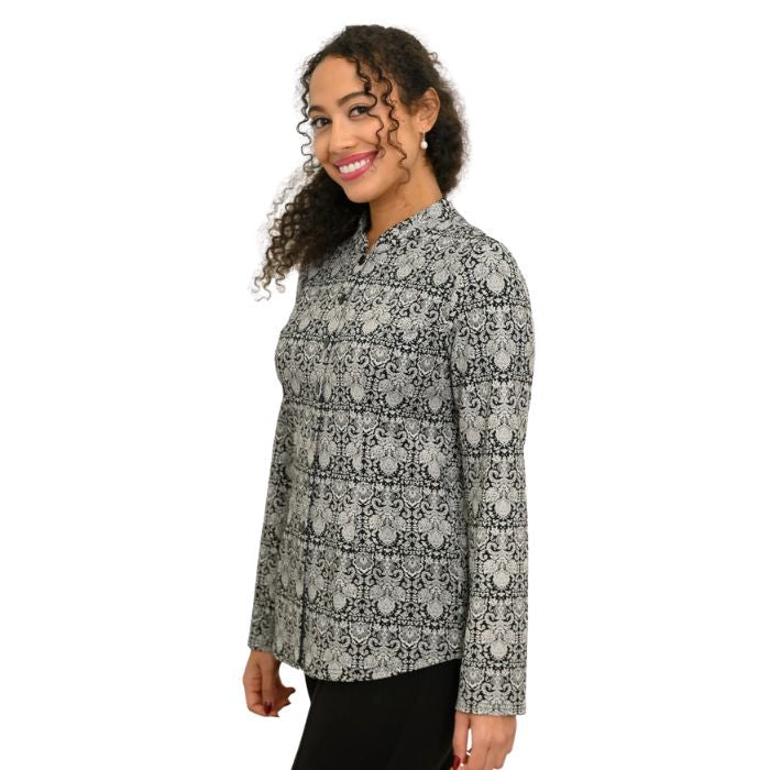 a woman wearing night lace print debbie blouse waist up side view set on a studio white background