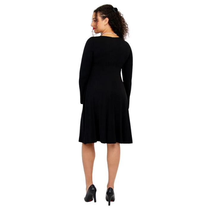 female model wearing black denver dress back view on white background