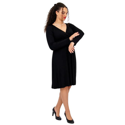 female model wearing black denver dress side view on white background