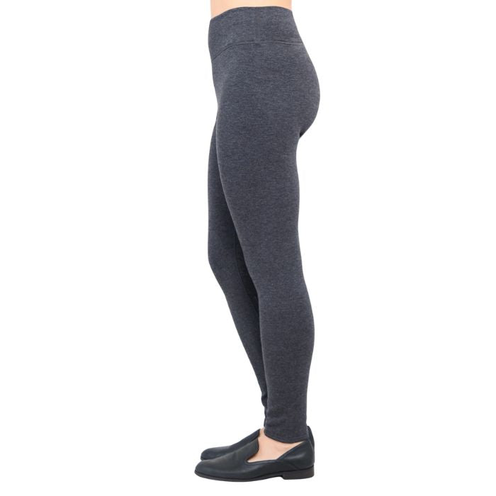 bottom of female model wearing dixie granite grey fleece leggings side view on white background