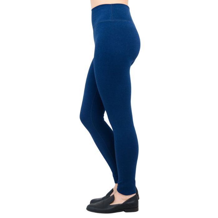 bottom of female model wearing dixie Indigo blue fleece leggings side view on white background