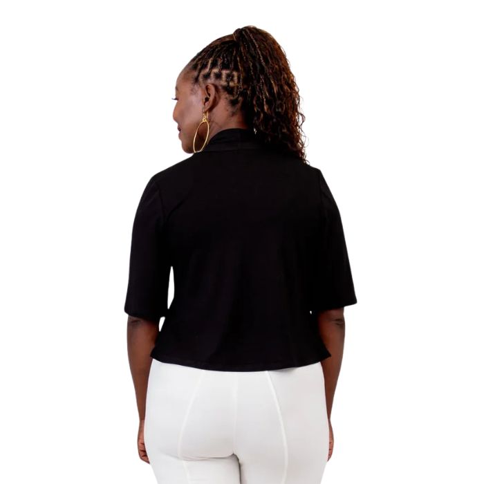 female model wearing black doda jacket  back view on white background