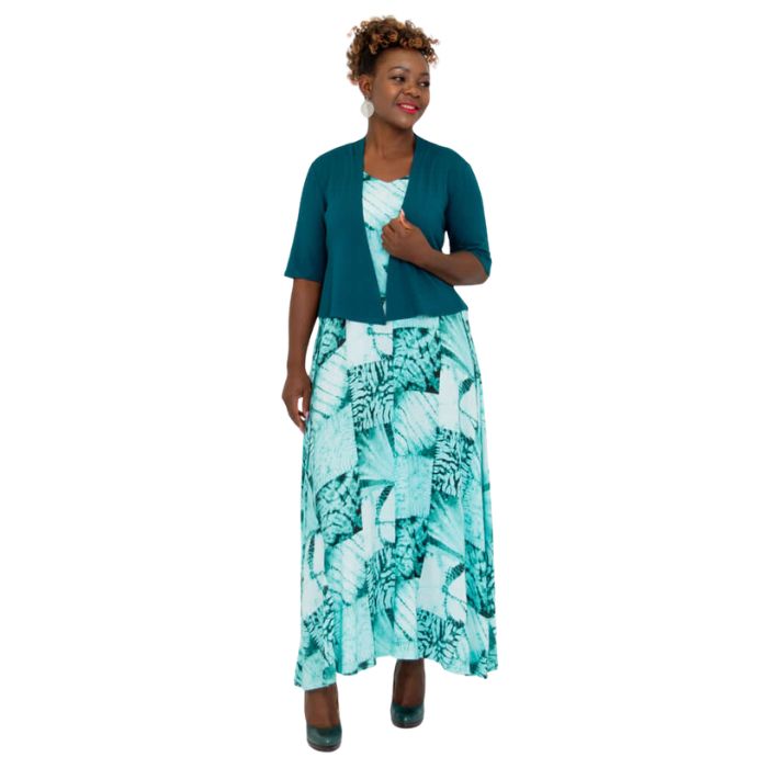 female model wearing teal green doda jacket and print maxi dress front view on white background