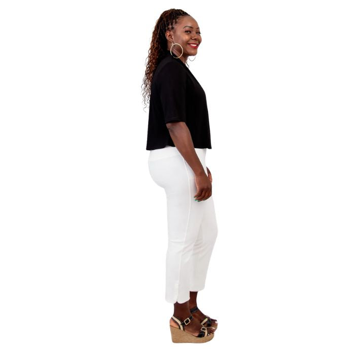 female model wearing black doda jacket, black reanna tank top and white nadine cropped pants side view on white background